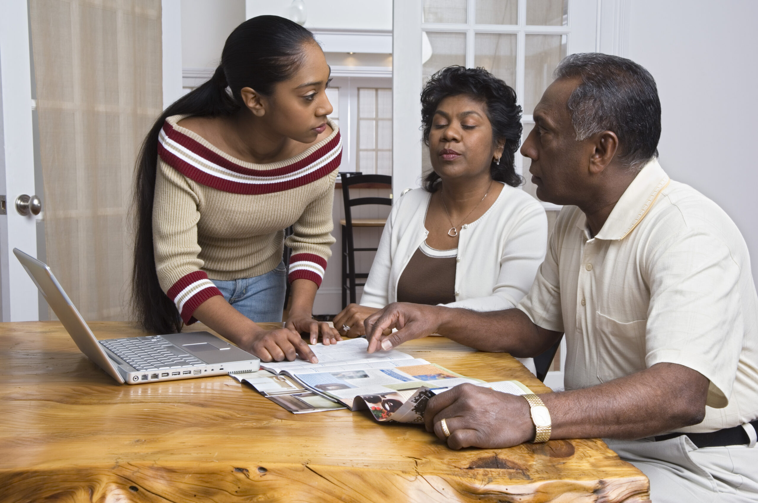 Parents and daughter conversing